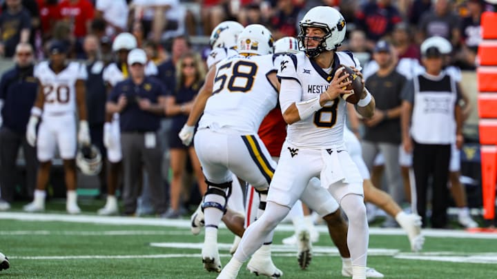 Oct 26, 2024; Tucson, Arizona, USA; West Virginia Mountaineers quarterback Nicco Marchiol (8) looks to throw the ball during the first quarter against the Arizona Wildcats at Arizona Stadium. Mandatory Credit: Aryanna Frank-Imagn Images