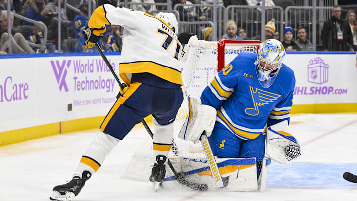 Dec 15, 2025; St. Louis, Missouri, USA; St. Louis Blues goaltender Joel Hofer (30) defends the net against Nashville Predators right wing Matthew Wood (71) during the third period at Enterprise Center. Mandatory Credit: Jeff Curry-Imagn Images Dec 15, 2025; St. Louis, Missouri, USA; St. Louis Blues goaltender Joel Hofer (30) defends the net against Nashville Predators right wing Matthew Wood (71) during the third period at Enterprise Center. Mandatory Credit: Jeff Curry-Imagn Images