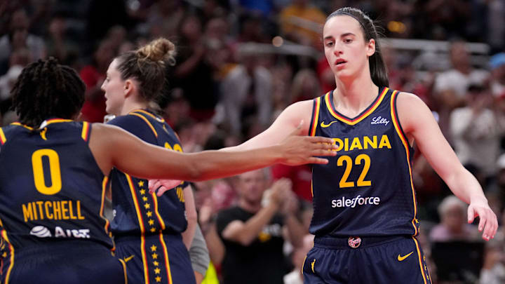 Indiana Fever guard Caitlin Clark (22) and guard Kelsey Mitchell (0) celebrate.