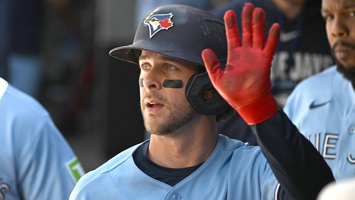 Toronto Blue Jays second baseman Ernie Clement (22) celebrates in the dugout with teammates after scoring a run against the Baltimore Orioles in the second inning at Rogers Centre. Toronto Blue Jays second baseman Ernie Clement (22) celebrates in the dugout with teammates after scoring a run against the Baltimore Orioles in the second inning at Rogers Centre.