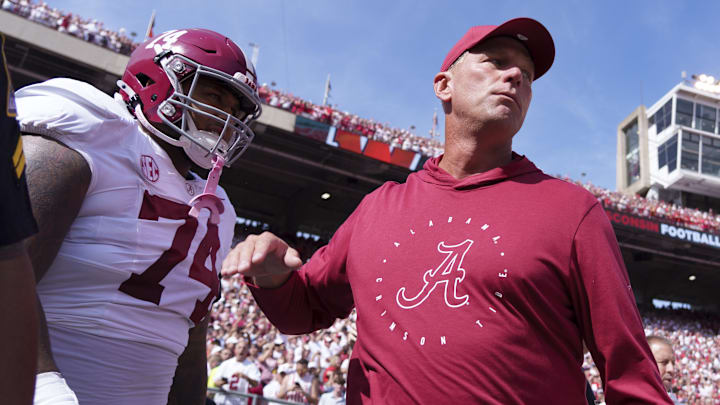 Sep 14, 2024; Madison, Wisconsin, USA;  Alabama Crimson Tide head coach Kalen DeBoer greets offensive linenam Kadyn Proctor (74) prior to the game against the Wisconsin Badgers at Camp Randall Stadium. Mandatory Credit: Jeff Hanisch-Imagn Images
