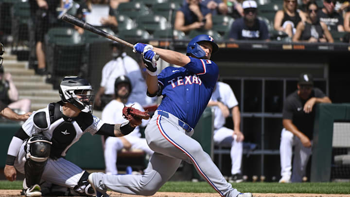 Aug 29, 2024; Chicago, Illinois, USA; Texas Rangers shortstop Corey Seager (5) hits a solo home run against the Chicago White Sox during the fourth inning at Guaranteed Rate Field. Aug 29, 2024; Chicago, Illinois, USA; Texas Rangers shortstop Corey Seager (5) hits a solo home run against the Chicago White Sox during the fourth inning at Guaranteed Rate Field.