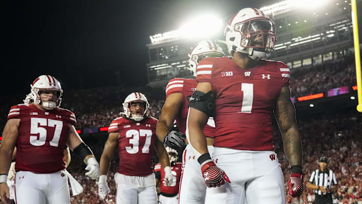 Wisconsin Badgers running back Chez Mellusi (1) celebrates after scoring a touchdown Wisconsin Badgers running back Chez Mellusi (1) celebrates after scoring a touchdown
