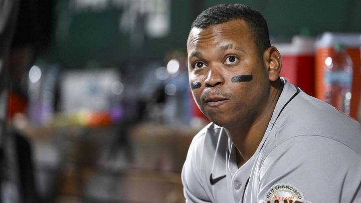 San Francisco Giants designated hitter Rafael Devers (16) looks on from the dugout. San Francisco Giants designated hitter Rafael Devers (16) looks on from the dugout.