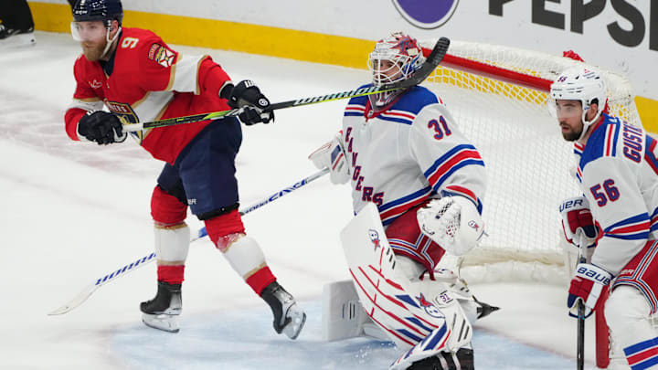 Jun 1, 2024; Sunrise, Florida, USA; The stick of Florida Panthers center Sam Bennett (9) collides with New York Rangers goaltender Igor Shesterkin (31) during the second period in game six of the Eastern Conference Final of the 2024 Stanley Cup Playoffs at Amerant Bank Arena. Mandatory Credit: Jim Rassol-Imagn Images