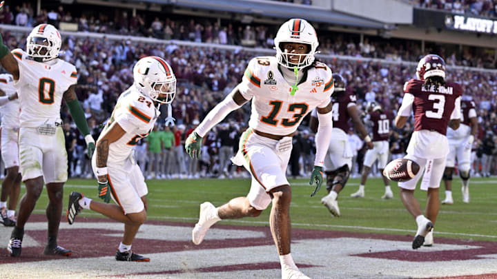 Dec 20, 2025; College Station, TX, USA;  Miami Hurricanes defensive back Bryce Fitzgerald (13) celebrates after he intercepts a Texas A&M Aggies pass to clinch the Miami win at Kyle Field. Mandatory Credit: Jerome Miron-Imagn Images