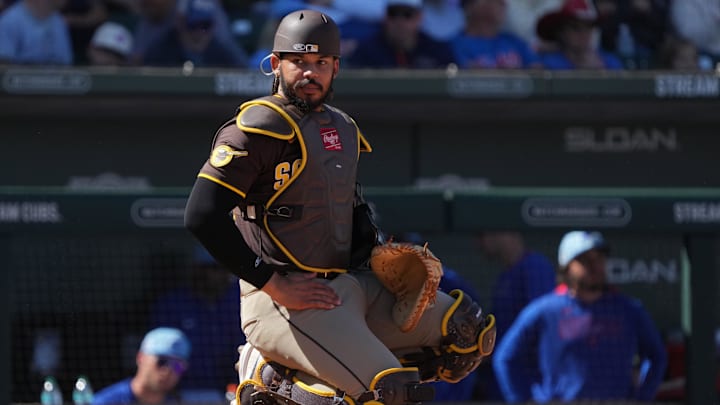 Mar 4, 2025; Mesa, Arizona, USA; San Diego Padres catcher Luis Campusano (12) looks for a sign against the Chicago Cubs in the third inning at Sloan Park. Mandatory Credit: Rick Scuteri-Imagn Images