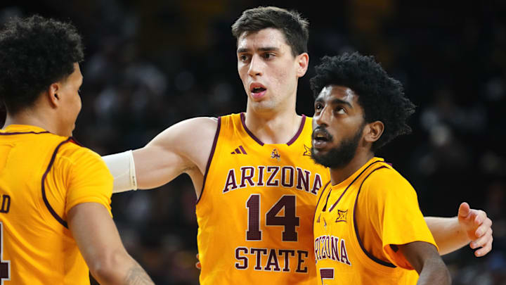 Arizona State forward Andrija Grbović (14) gathers Bryce Ford (4) and Moe Odum (5) during a game against Cincinnati at Desert Financial Arena in Tempe, Ariz., on Jan. 24, 2026. Arizona State forward Andrija Grbović (14) gathers Bryce Ford (4) and Moe Odum (5) during a game against Cincinnati at Desert Financial Arena in Tempe, Ariz., on Jan. 24, 2026.