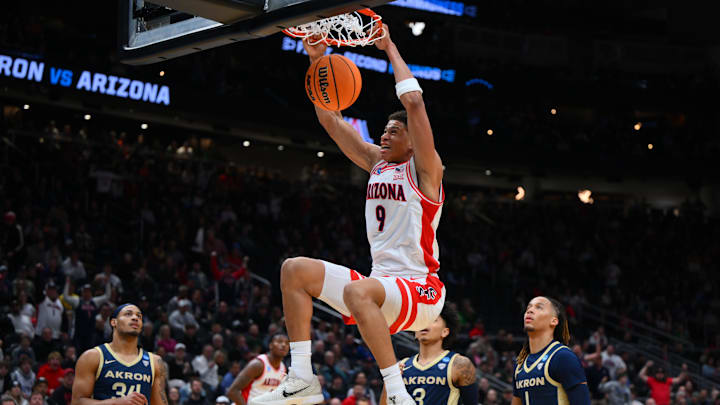 Arizona Wildcats forward Carter Bryant (9) dunks the ball against the Akron Zips during the first half in the first round of the NCAA Tournament at Climate Pledge Arena.