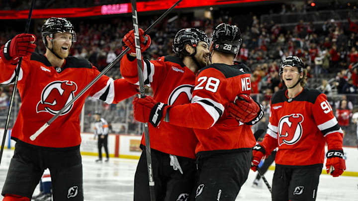 Oct 19, 2024; Newark, New Jersey, USA; New Jersey Devils center Nico Hischier (13) celebrates with teammates after scoring a goal against the Washington Capitals during the second period at Prudential Center. Mandatory Credit: John Jones-Imagn Images