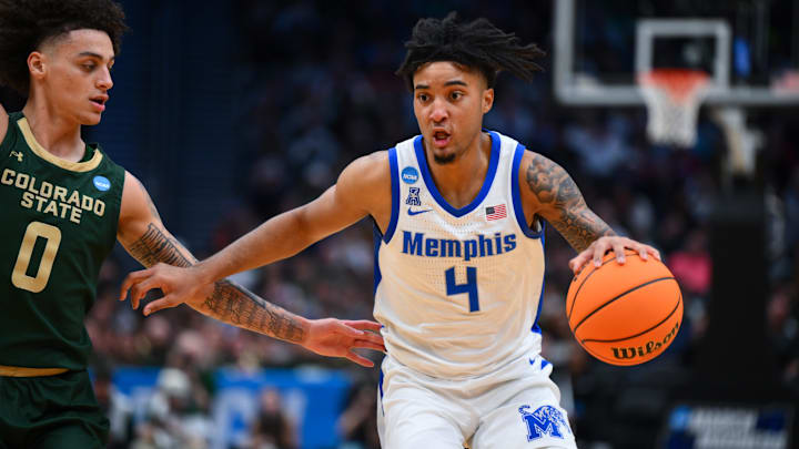 Mar 21, 2025; Seattle, WA, USA; Memphis Tigers guard PJ Haggerty (4) drives the ball during the second half against Colorado State Rams at Climate Pledge Arena. Mandatory Credit: Steven Bisig-Imagn Images