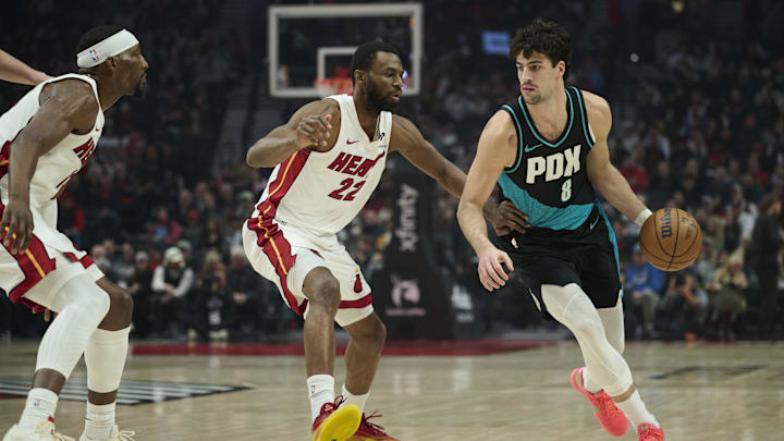 Jan 22, 2026; Portland, Oregon, USA; Portland Trail Blazers forward Deni Avdija (8) dribbles the ball during the first half against Miami Heat forward Andrew Wiggins (22) at Moda Center. Mandatory Credit: Troy Wayrynen-Imagn Images