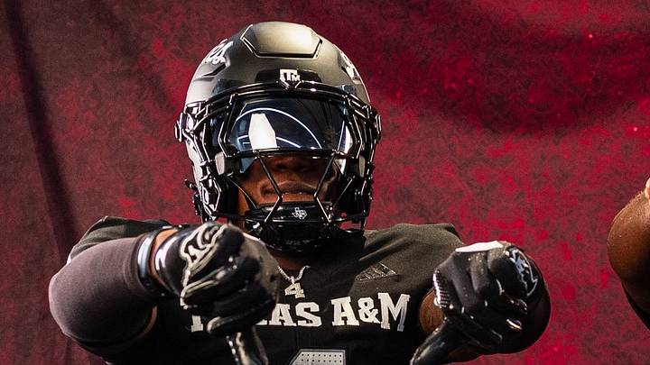 Class of 2027 recruit Joshua Dobson poses in a Texas A&M uniform during a visit. Via @JoshuaDobsonDB on X Class of 2027 recruit Joshua Dobson poses in a Texas A&M uniform during a visit. Via @JoshuaDobsonDB on X