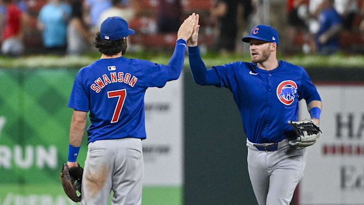 Jul 12, 2024; St. Louis, Missouri, USA;  Chicago Cubs left fielder Ian Happ and shortstop Dansby Swanson celebrate.