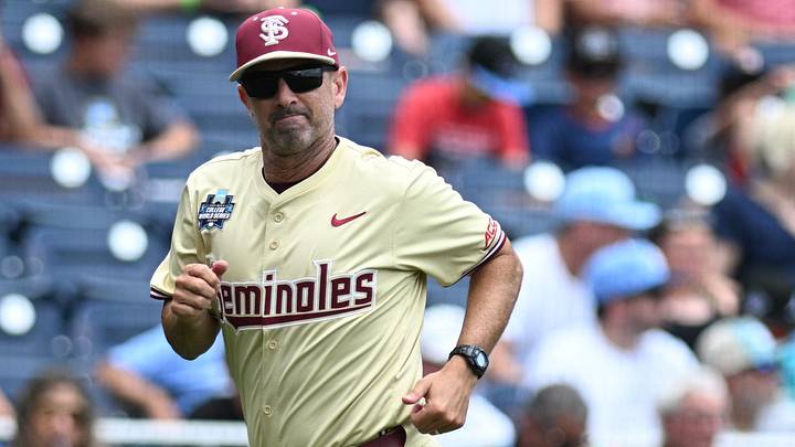 Jun 18, 2024; Omaha, NE, USA; Florida State Seminoles head coach Link Jarrett heads to the dugout before a game against the North Carolina Tar Heels at Charles Schwab Field Omaha. Mandatory Credit: Steven Branscombe-Imagn Images