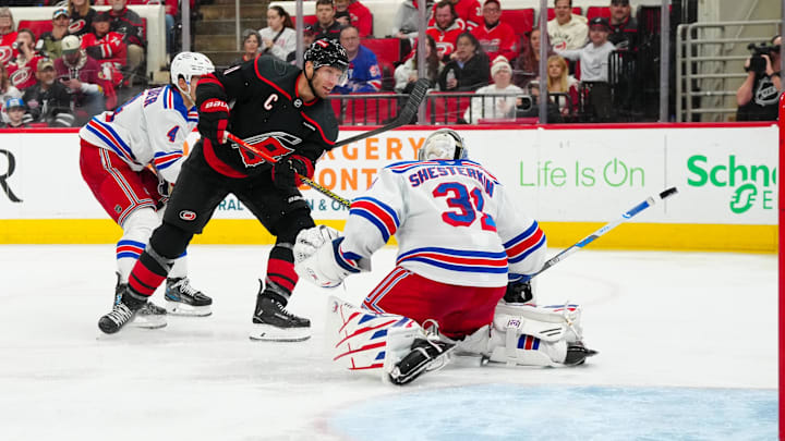 Apr 12, 2025; Raleigh, North Carolina, USA;  aCarolina Hurricanes center Jordan Staal (11) scores a goal past New York Rangers goaltender Igor Shesterkin (31) during the third period t Lenovo Center. Mandatory Credit: James Guillory-Imagn Images