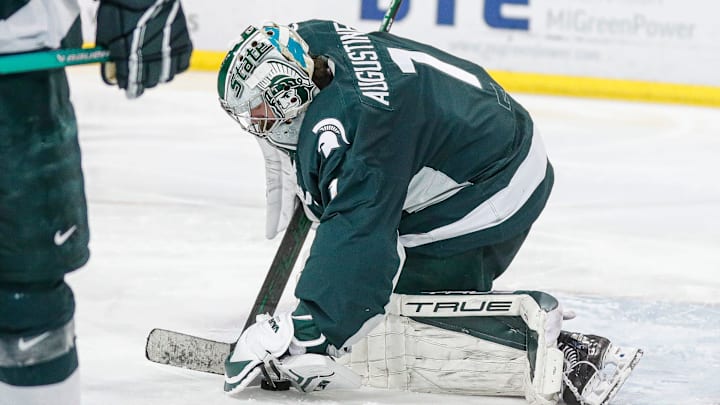 Michigan State goaltender Trey Augustine makes a save against Michigan during the third period at Yost Ice Arena in Ann Arbor on Friday, Feb. 9, 2024.