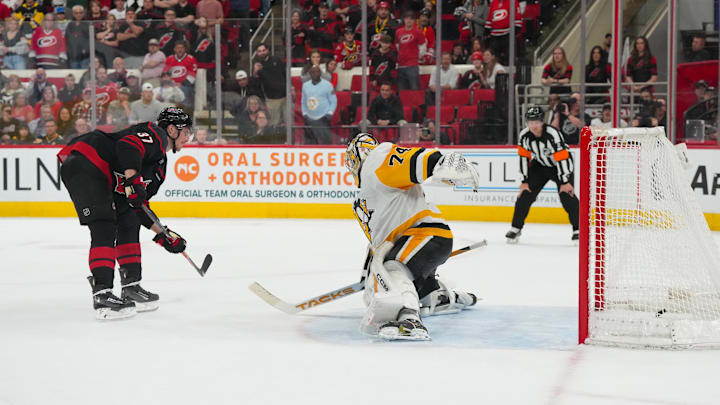 Mar 10, 2026; Raleigh, North Carolina, USA;  Carolina Hurricanes right wing Andrei Svechnikov (37 scores a goal on his shootout attempt against Pittsburgh Penguins goaltender Stuart Skinner (74) at Lenovo Center. Mandatory Credit: James Guillory-Imagn Images