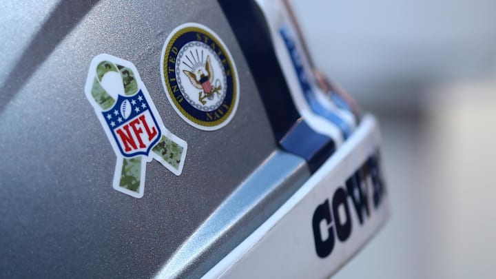 Nov 6, 2016; Cleveland, OH, USA; A view of the NFL's Salute to Service logo alongside a sticker for the United States Navy on a Dallas Cowboys helmet at FirstEnergy Stadium. The Cowboys won 35-10. Mandatory Credit: Aaron Doster-Imagn Images Nov 6, 2016; Cleveland, OH, USA; A view of the NFL's Salute to Service logo alongside a sticker for the United States Navy on a Dallas Cowboys helmet at FirstEnergy Stadium. The Cowboys won 35-10. Mandatory Credit: Aaron Doster-Imagn Images