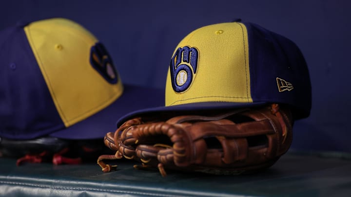 Jul 28, 2023; Atlanta, Georgia, USA; A detailed view of a Milwaukee Brewers hat and glove on the bench against the Atlanta Braves in the second inning at Truist Park. Mandatory Credit: Brett Davis-Imagn Images Jul 28, 2023; Atlanta, Georgia, USA; A detailed view of a Milwaukee Brewers hat and glove on the bench against the Atlanta Braves in the second inning at Truist Park. Mandatory Credit: Brett Davis-Imagn Images