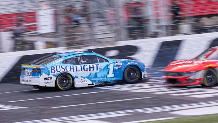Oct 5, 2025; Concord, North Carolina, USA; NASCAR Cup Series driver Ross Chastain (1) backs across the finish line at Charlotte Motor Speedway Road Course.