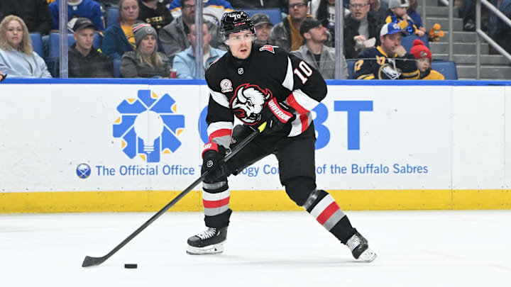 Jan 31, 2025; Buffalo, New York, USA; Buffalo Sabres defenseman Henri Jokiharju (10) skates with the puck in the first period in a game against the Nashville Predators at the KeyBank Center. Mandatory Credit: Mark Konezny-Imagn Images
