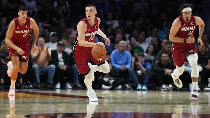 Nov 24, 2025; Miami, Florida, USA; Miami Heat guard Tyler Herro (14) brings the ball up the court against the Dallas Mavericks in the first half at Kaseya Center. Mandatory Credit: Jim Rassol-Imagn Images
