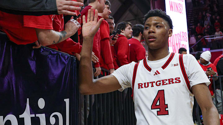 Mar 9, 2025; Piscataway, New Jersey, USA; Rutgers Scarlet Knights guard Ace Bailey (4) slap hands with fans after the game against the Minnesota Golden Gophers at Jersey Mike's Arena. Mandatory Credit: Vincent Carchietta-Imagn Images