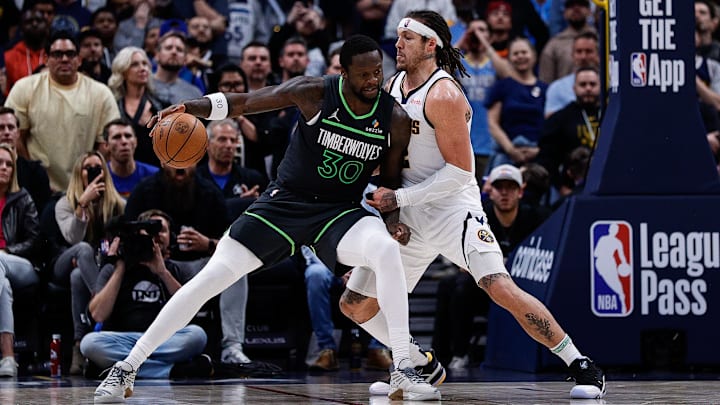 Apr 1, 2025; Denver, Colorado, USA; Minnesota Timberwolves forward Julius Randle (30) controls the ball against Denver Nuggets forward Aaron Gordon (32) in overtime at Ball Arena. Mandatory Credit: Isaiah J. Downing-Imagn Images Apr 1, 2025; Denver, Colorado, USA; Minnesota Timberwolves forward Julius Randle (30) controls the ball against Denver Nuggets forward Aaron Gordon (32) in overtime at Ball Arena. Mandatory Credit: Isaiah J. Downing-Imagn Images