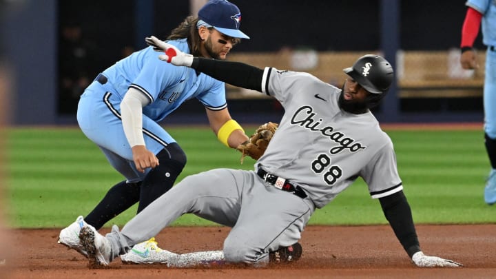 Apr 26, 2023; Toronto, Ontario, CAN; Chicago White Sox center fielder Luis Robert Jr. (88) is tagged out at second base by Toronto Blue Jays shortstop Bo Bichette (11) in the first inning at Rogers Centre. Mandatory Credit: Dan Hamilton-USA TODAY Sports Apr 26, 2023; Toronto, Ontario, CAN; Chicago White Sox center fielder Luis Robert Jr. (88) is tagged out at second base by Toronto Blue Jays shortstop Bo Bichette (11) in the first inning at Rogers Centre. Mandatory Credit: Dan Hamilton-USA TODAY Sports