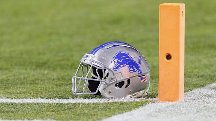 Jan 8, 2023; Green Bay, Wisconsin, USA;  A Detroit Lions helmet sits on the field during warmups prior to the game against the Green Bay Packers at Lambeau Field. Mandatory Credit: Jeff Hanisch-Imagn Images
