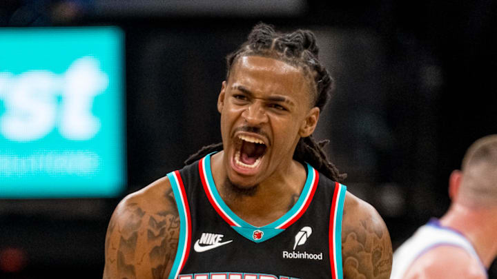Dec. 12, 2025; Memphis, Tennessee, USA; Memphis Grizzlies point guard Ja Morant (12) celebrates after making a three-pointer in the second half against the Utah Jazz at FedExForum. Dec. 12, 2025; Memphis, Tennessee, USA; Memphis Grizzlies point guard Ja Morant (12) celebrates after making a three-pointer in the second half against the Utah Jazz at FedExForum.