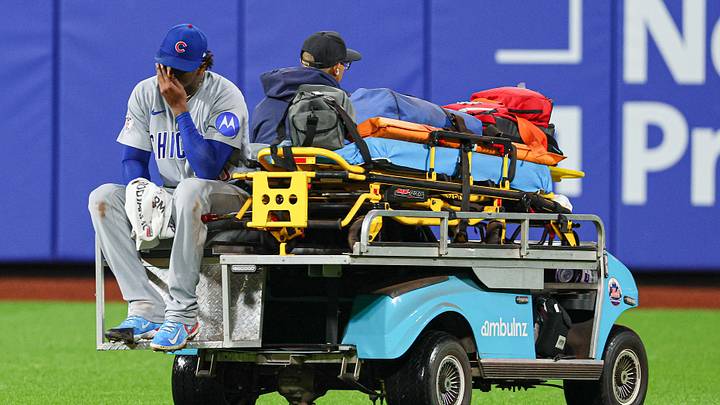 Jun 23, 2026; New York City, New York, USA; Chicago Cubs pitcher Edward Cabrera (30) is driven off the field  after an injury at first base during the fifth inning against the New York Mets at Citi Field. Mandatory Credit: Vincent Carchietta-Imagn Images