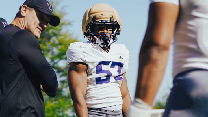 Anthony Ward stands with linebackers coach Brian Odom in spring ball. Anthony Ward stands with linebackers coach Brian Odom in spring ball.