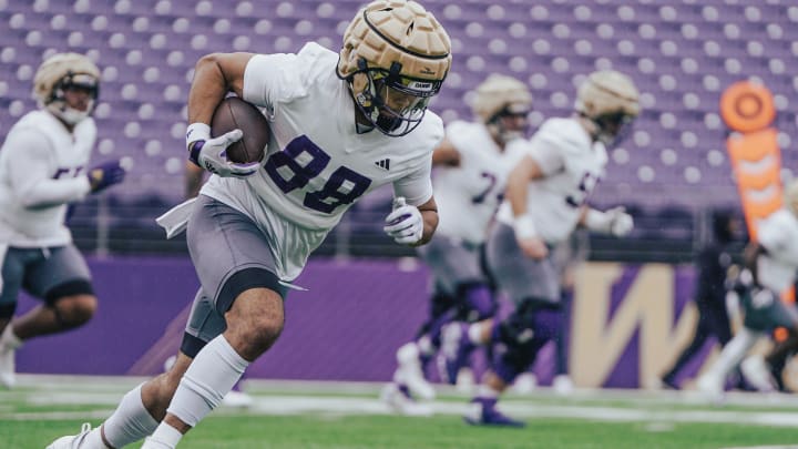 UW tight end Quentin Moore heads upfield with a spring reception. 