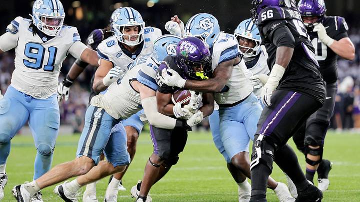 Aug 29, 2026; Dublin, Co. Dublin, IRL;  TCU Horned Frogs running back Jeremy Payne (26) is tackled by North Carolina Tar Heels linebacker Derek McDonald (15) and linebacker Jonathan Agumadu (8) in the second half at Aviva Stadium.  Mandatory Credit: Laszlo Geczo-Imagn Images