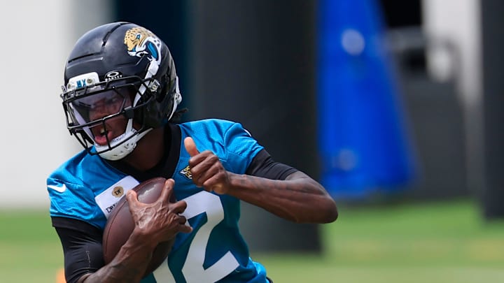 Jacksonville Jaguars wide receiver Travis Hunter (12) runs the ball during a rookie minicamp at Miller Electric Center Saturday, May 10, 2025 in Jacksonville, Fla. [Corey Perrine/Florida Times-Union]