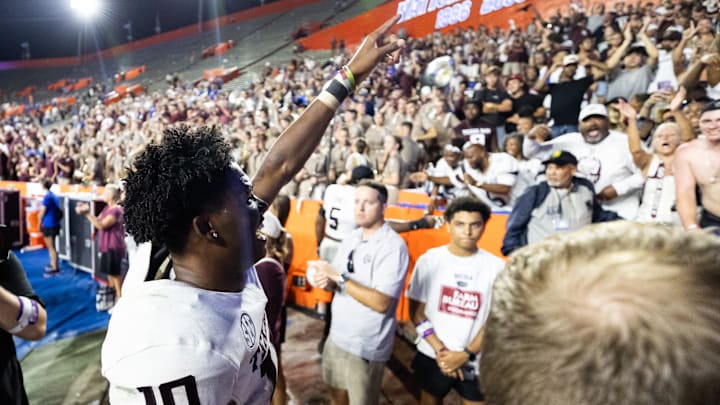 Sep 14, 2024; Gainesville, Florida, USA; Texas A&M Aggies quarterback Marcel Reed (10) celebrates after defeating the Florida Gators at Ben Hill Griffin Stadium. Mandatory Credit: Matt Pendleton-Imagn Images