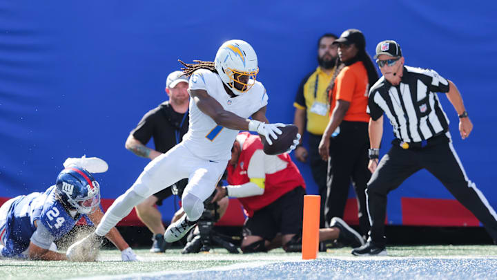 Sep 28, 2025; East Rutherford, New Jersey, USA; Los Angeles Chargers wide receiver Quentin Johnston (1) scores a touchdown as New York Giants safety Dane Belton (24) defends during the second quarter at MetLife Stadium. Mandatory Credit: Brad Penner-Imagn Images Sep 28, 2025; East Rutherford, New Jersey, USA; Los Angeles Chargers wide receiver Quentin Johnston (1) scores a touchdown as New York Giants safety Dane Belton (24) defends during the second quarter at MetLife Stadium. Mandatory Credit: Brad Penner-Imagn Images
