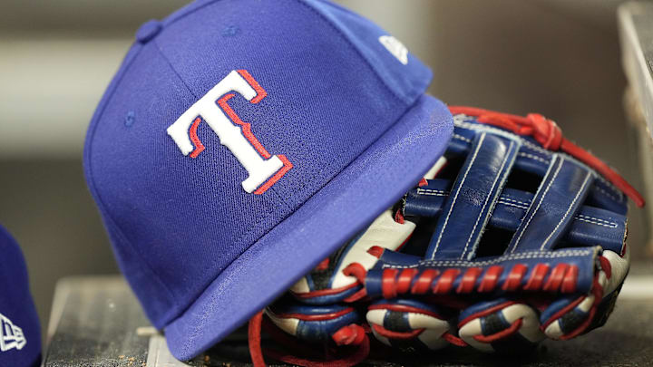 A hat and glove of a Texas Rangers player during a game against the Toronto Blue Jays at Rogers Centre. 