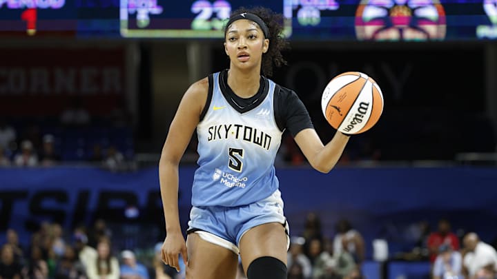 Jun 24, 2025; Chicago, Illinois, USA; Chicago Sky forward Angel Reese (5) brings the ball up court against the Los Angeles Sparks during the first half at Wintrust Arena. Mandatory Credit: Kamil Krzaczynski-Imagn Images