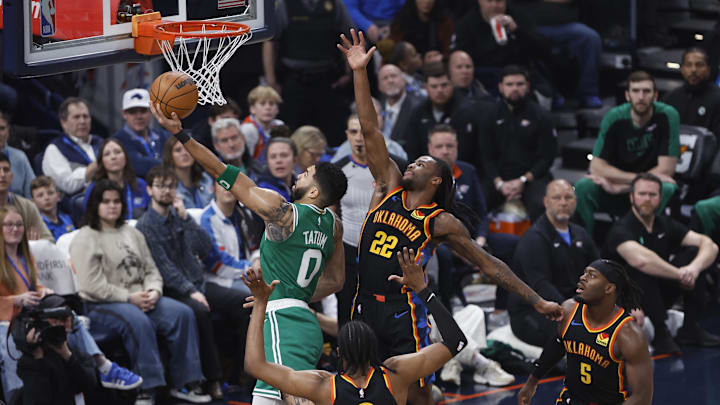 Jan 5, 2025; Oklahoma City, Oklahoma, USA; Boston Celtics forward Jayson Tatum (0) shoots the ball as Oklahoma City Thunder guard Cason Wallace (22) defends during the first quarter at Paycom Center. Mandatory Credit: Alonzo Adams-Imagn Images Jan 5, 2025; Oklahoma City, Oklahoma, USA; Boston Celtics forward Jayson Tatum (0) shoots the ball as Oklahoma City Thunder guard Cason Wallace (22) defends during the first quarter at Paycom Center. Mandatory Credit: Alonzo Adams-Imagn Images