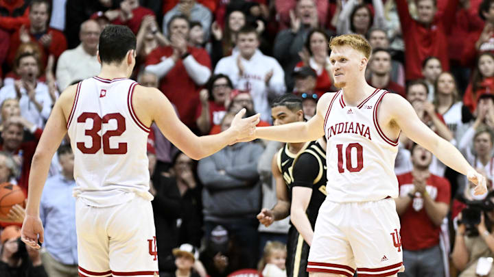 Hoosiers guard Trey Galloway, left, and forward Luke Goode celebrate after a play against the Boilermakers.