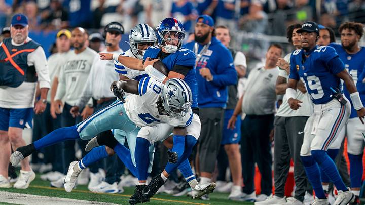 New York Giants quarterback Jaxson Dart (6) is hit out of bounds by Dallas Cowboys linebacker DeMarvion Overshown (0) during a week one opening game between the New York Giants and Dallas Cowboys at Metlife Stadium on Sunday, Sept. 13, 2026, in East Rutherford, NJ. New York Giants quarterback Jaxson Dart (6) is hit out of bounds by Dallas Cowboys linebacker DeMarvion Overshown (0) during a week one opening game between the New York Giants and Dallas Cowboys at Metlife Stadium on Sunday, Sept. 13, 2026, in East Rutherford, NJ.