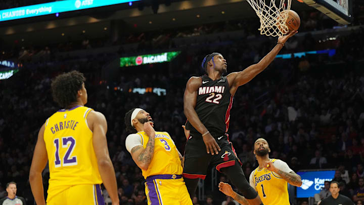 Dec 4, 2024; Miami, Florida, USA; Miami Heat forward Jimmy Butler (22) goes up for a layup against the Los Angeles Lakers in the first half at Kaseya Center. Mandatory Credit: Jim Rassol-Imagn Images