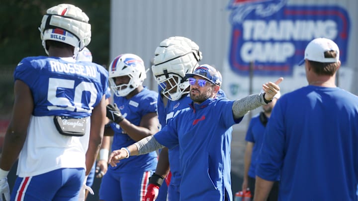 Bills defensive coordinator Bobby Babich talks with the defensive line during training camp.