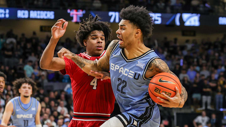Jan 31, 2026; Orlando, Florida, USA; UCF Knights guard Chris Johnson (22) drives to the basket against Texas Tech Red Raiders guard Christian Anderson (4) during the second half at Addition Financial Arena. Mandatory Credit: Mike Watters-Imagn Images Jan 31, 2026; Orlando, Florida, USA; UCF Knights guard Chris Johnson (22) drives to the basket against Texas Tech Red Raiders guard Christian Anderson (4) during the second half at Addition Financial Arena. Mandatory Credit: Mike Watters-Imagn Images