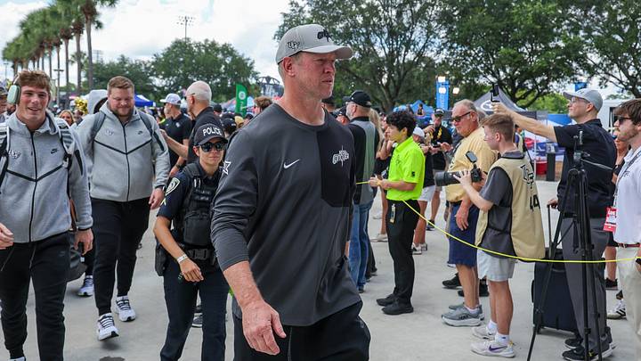 Sep 20, 2025; Orlando, Florida, USA; UCF Knights head coach Scott Frost walks into the venue before the game against the North Carolina Tar Heels at the Bounce House Stadium. Mandatory Credit: Mike Watters-Imagn Images Sep 20, 2025; Orlando, Florida, USA; UCF Knights head coach Scott Frost walks into the venue before the game against the North Carolina Tar Heels at the Bounce House Stadium. Mandatory Credit: Mike Watters-Imagn Images
