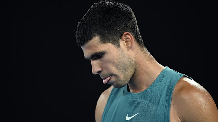  Carlos Alcaraz of Spain reacts during his match against Novak Djokovic of Serbia during the 2025 Australian Open.