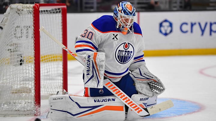 Apr 29, 2025; Los Angeles, California, USA; Edmonton Oilers goaltender Calvin Pickard (30) blocks a shot against the Los Angeles Kings during the second period in game five of the first round of the 2025 Stanley Cup Playoffs at Crypto.com Arena. Mandatory Credit: Gary A. Vasquez-Imagn Images